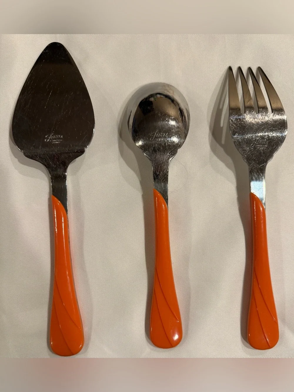 Fiesta ware 3 piece serving set, orange swirl pattern,fork/spoon/cake/pie server